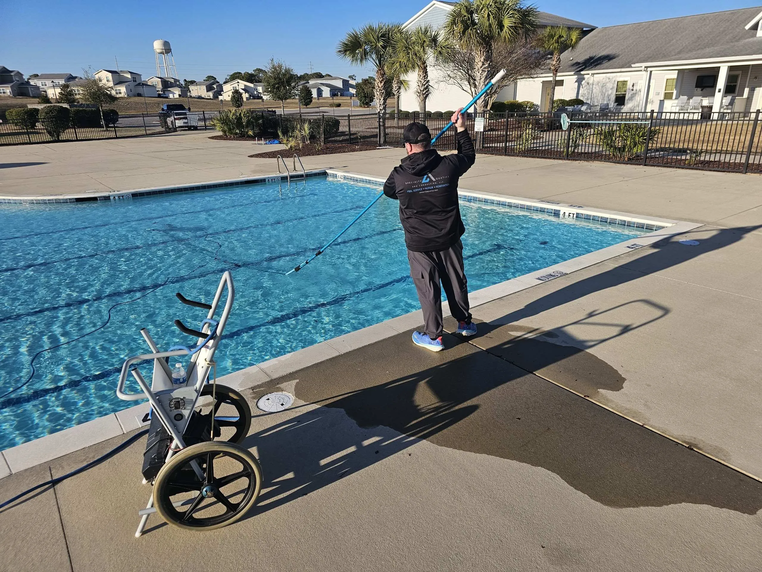 Commercial pool maintenance technician servicing a Georgia and Florida Panhandle facility