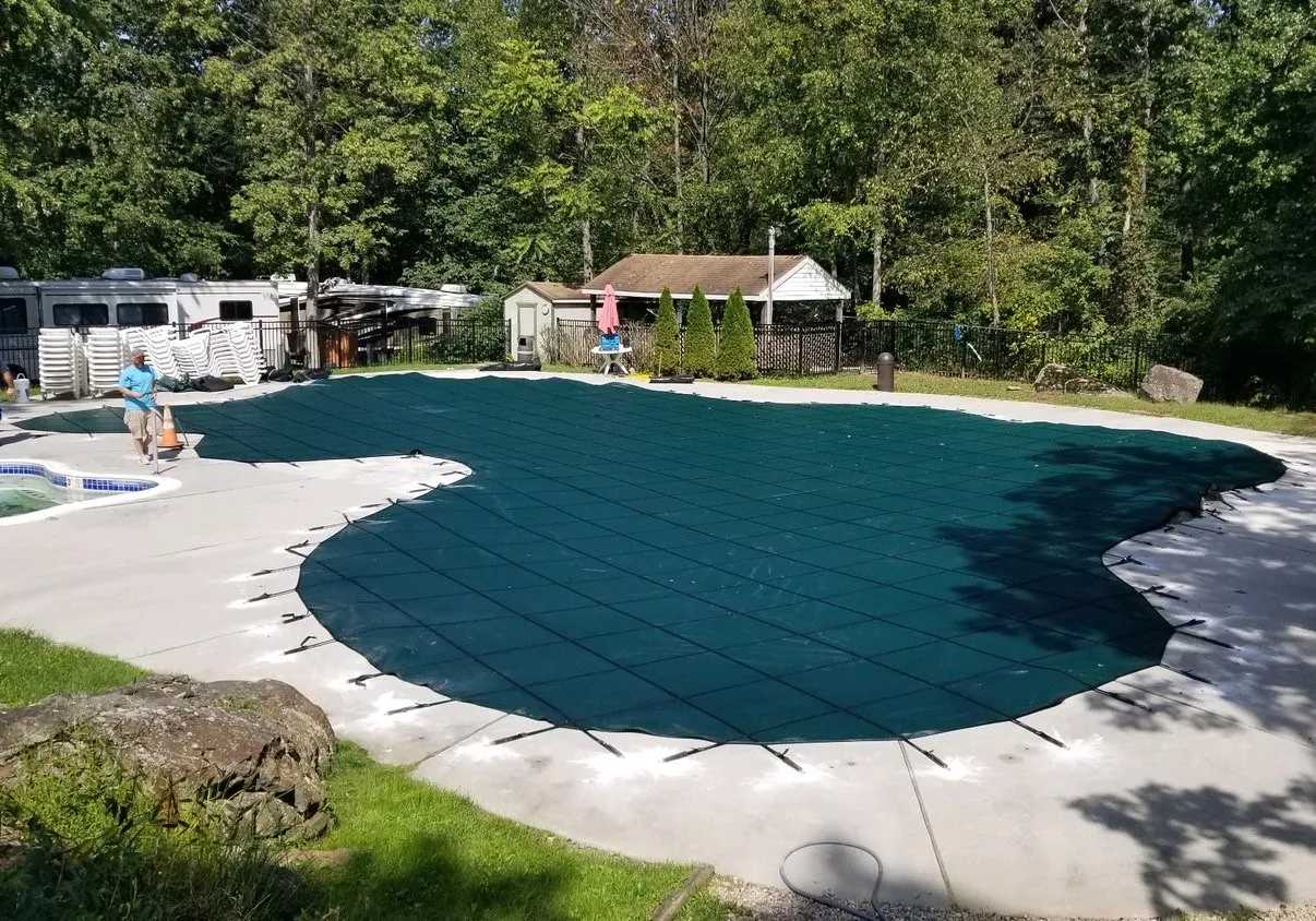 Commercial pool safety cover and ADA compliance equipment on deck